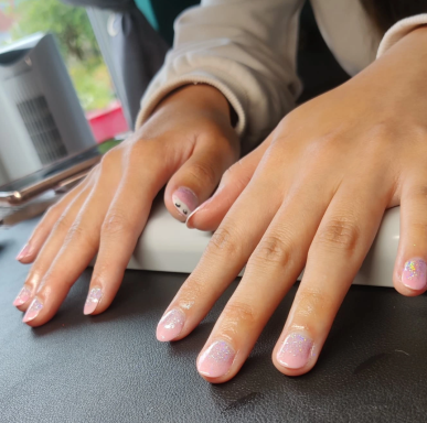 Pink Gel Polish with glitter and cheeky kitten nail art.